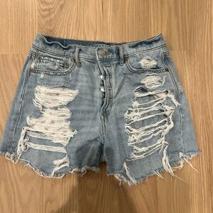 Denim shorts with flower print pockets